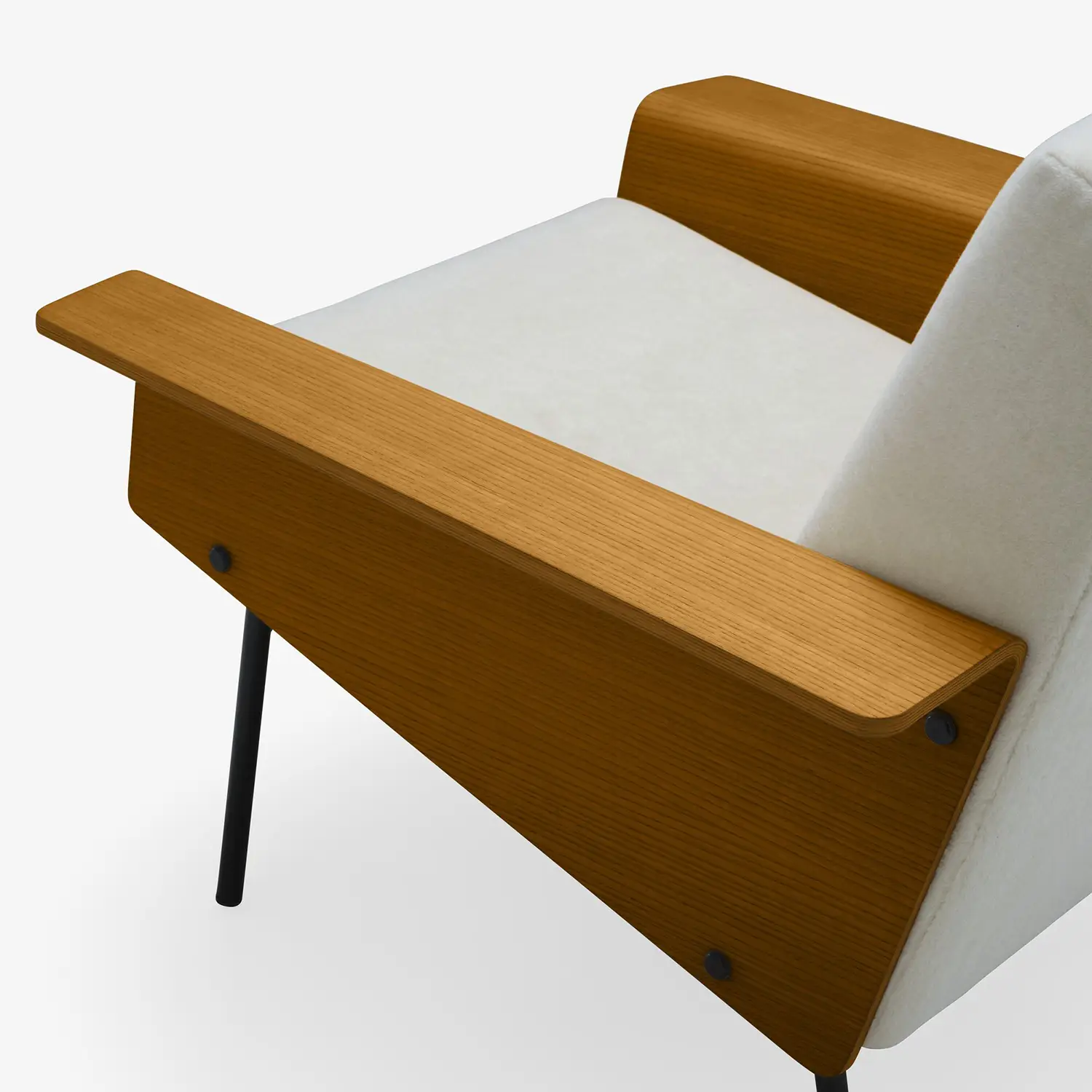 Close-up of a modern armchair with light wood armrests, black metal legs, and light gray upholstery.