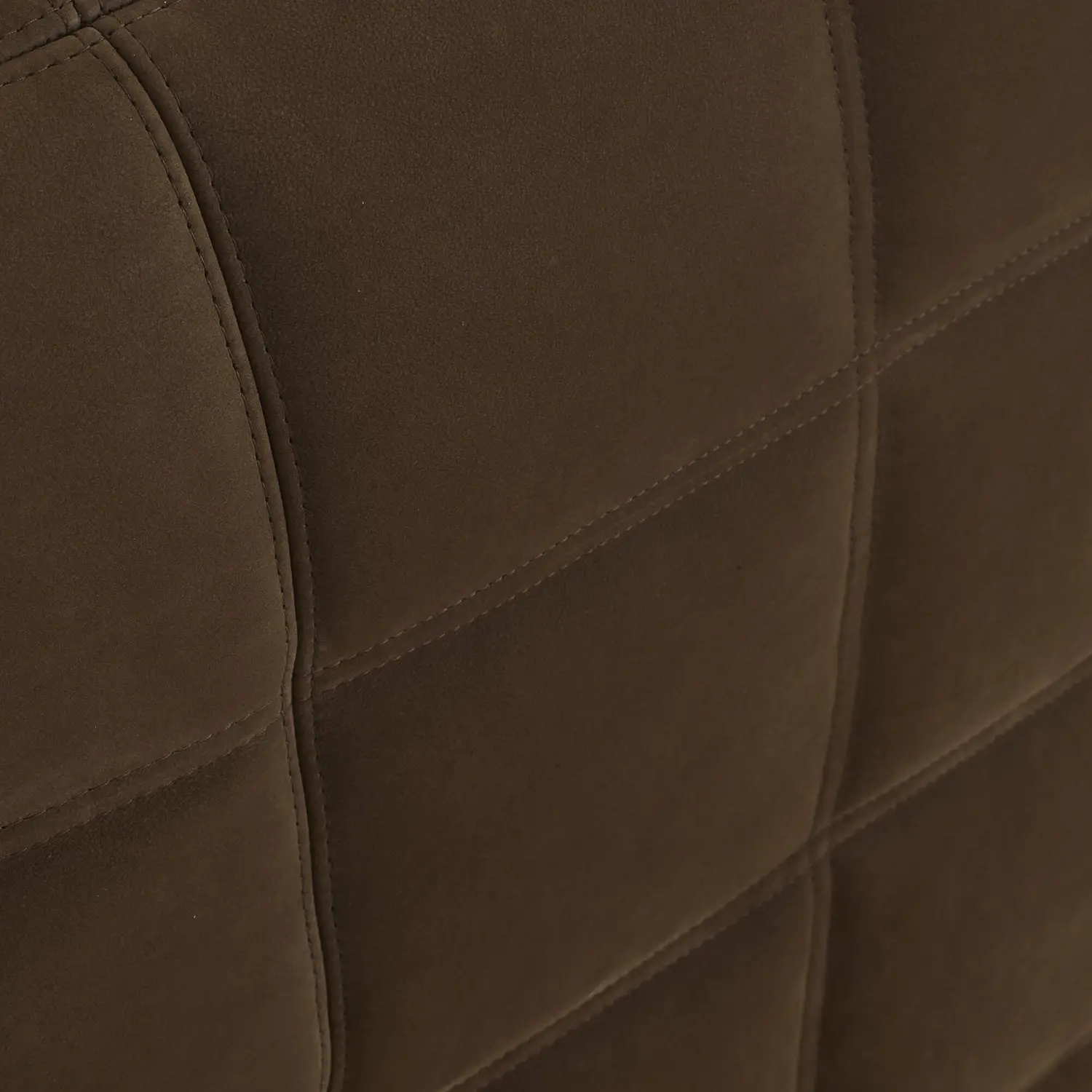 Close-up view of brown suede upholstery with diagonal and vertical stitching.