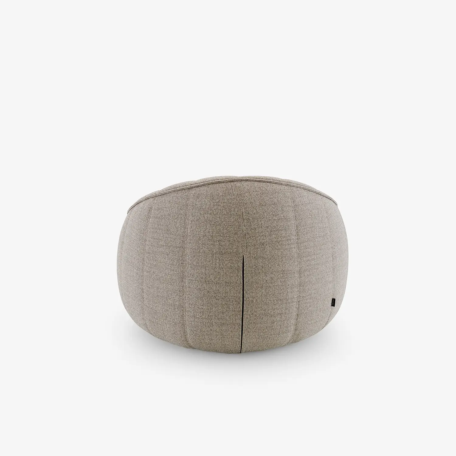 Back view of a round, beige upholstered ottoman armchair with subtle seam details.