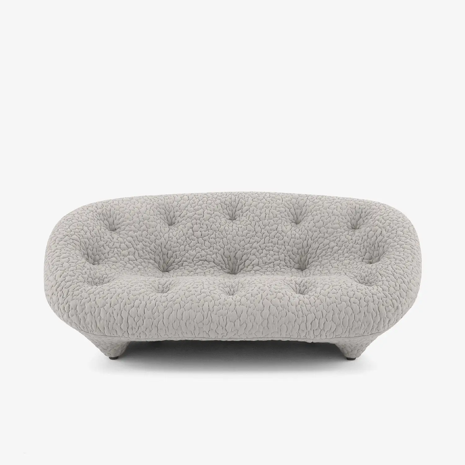 Rounded, tufted sofa upholstered in light gray textured fabric with short, tapered legs.