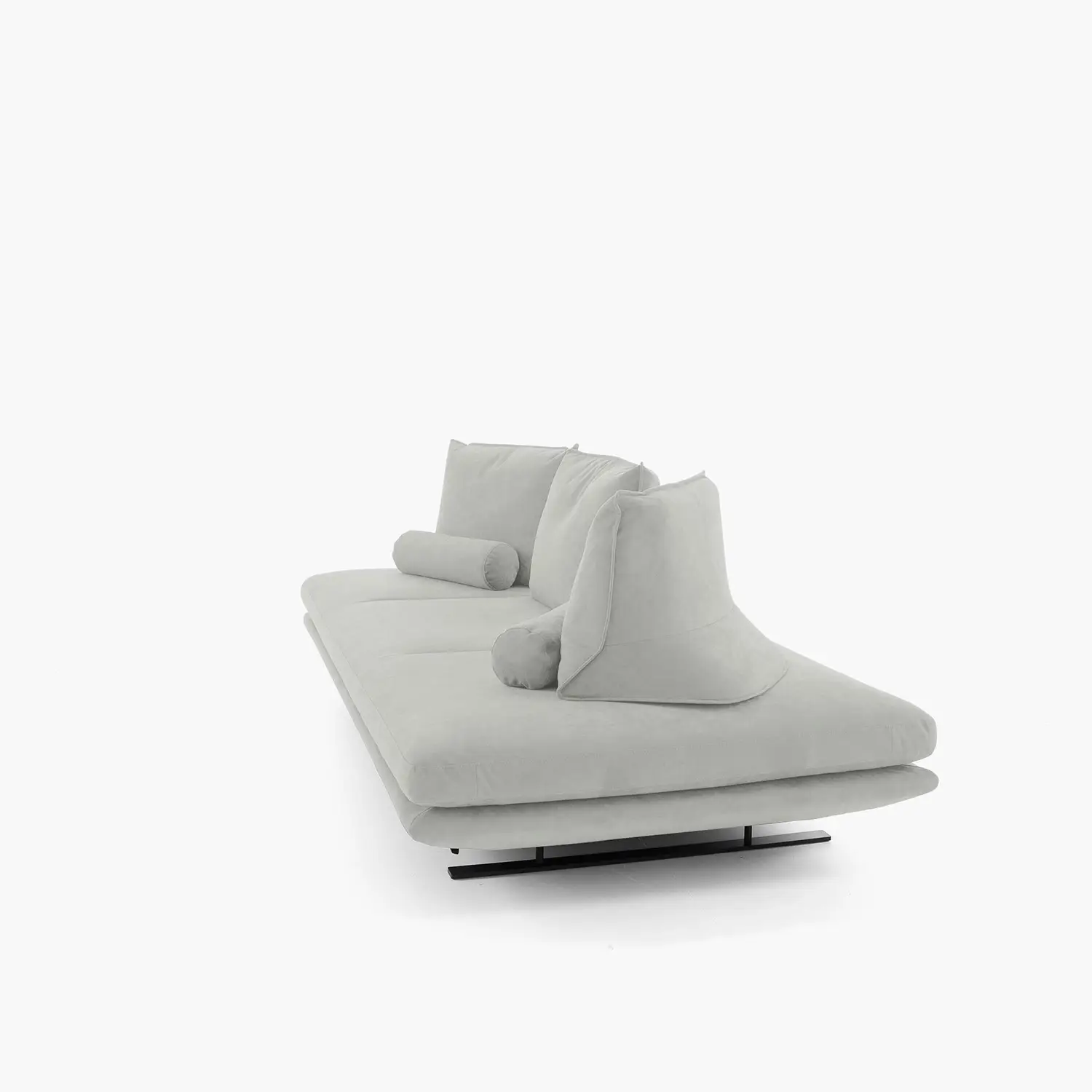Modern light gray upholstered large settee with two cylindrical bolster pillows and a black metal base on a white background.
