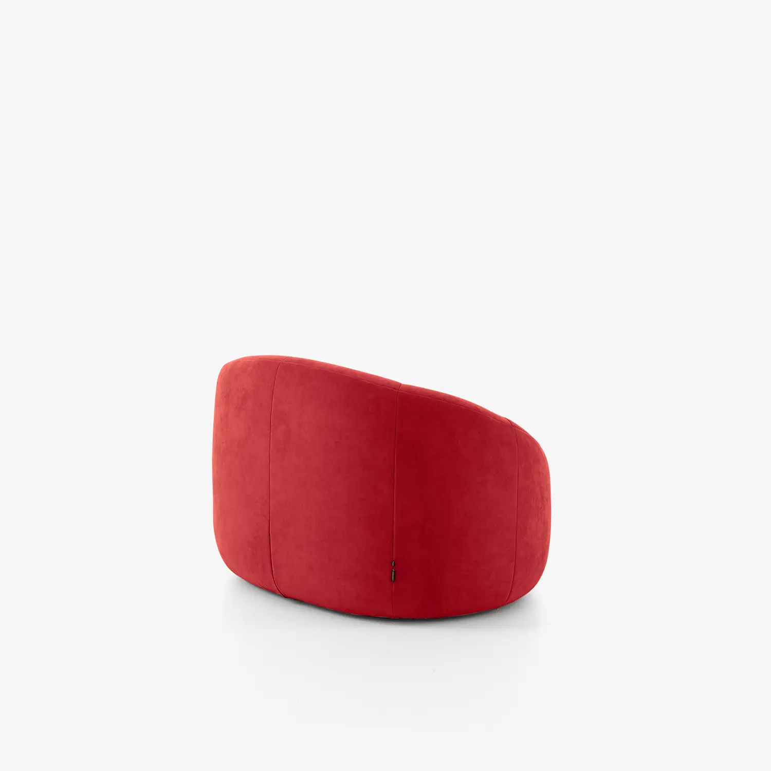 Modern, rounded red swivel armchair with smooth upholstery viewed from the back and side.