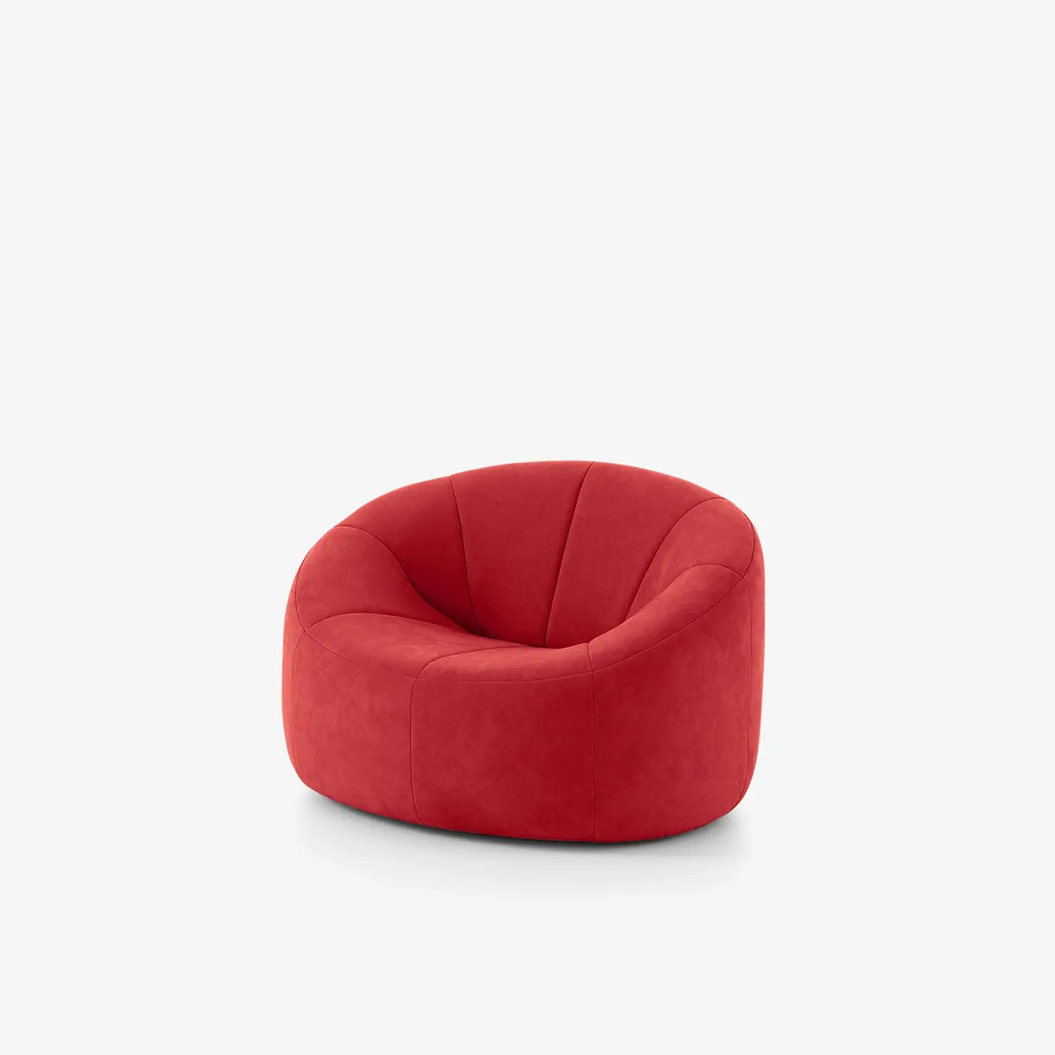 Plump deep red fabric armchair with rounded back and soft cushioned seat.