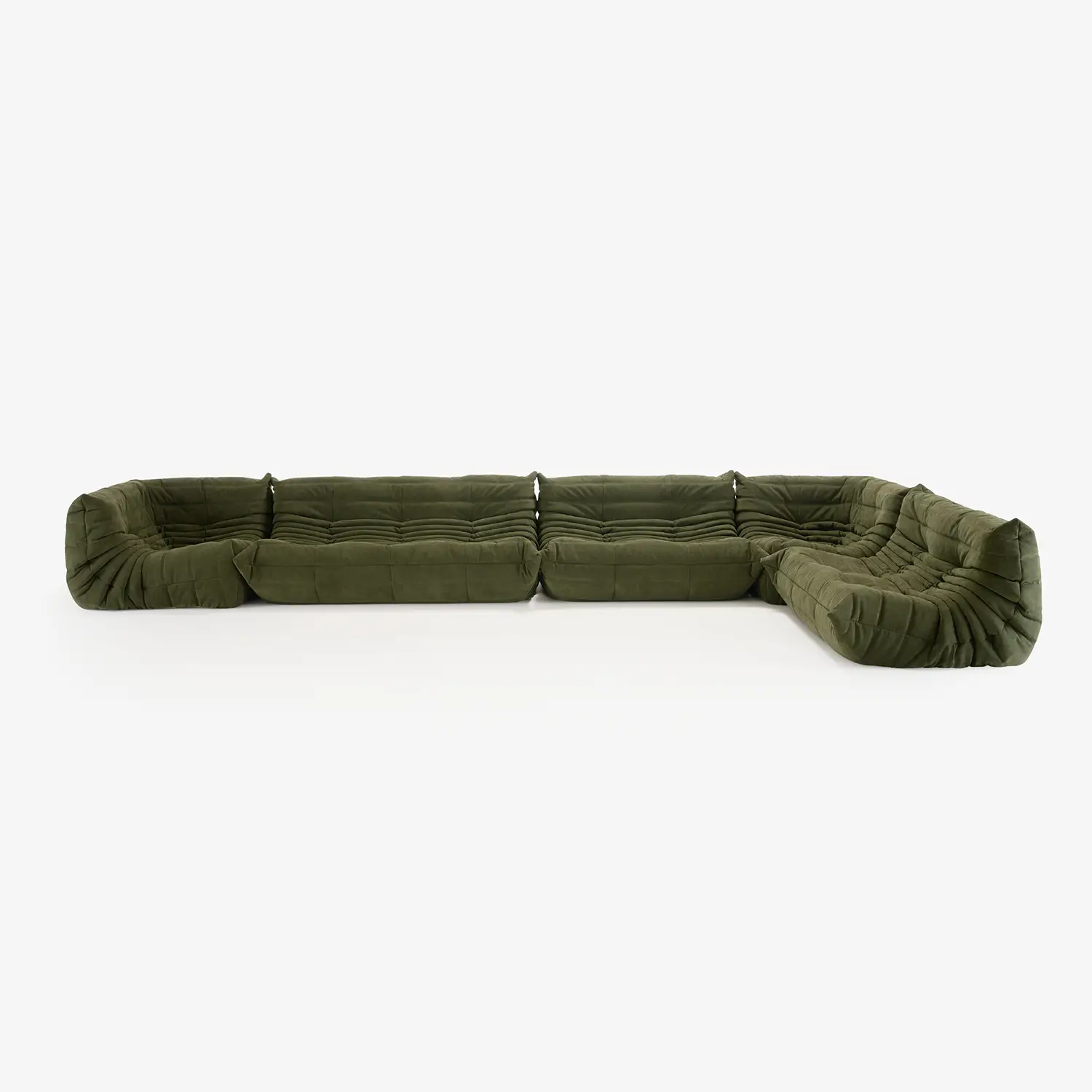 Large L-shaped sectional sofa with deep tufted cushions in olive green fabric.